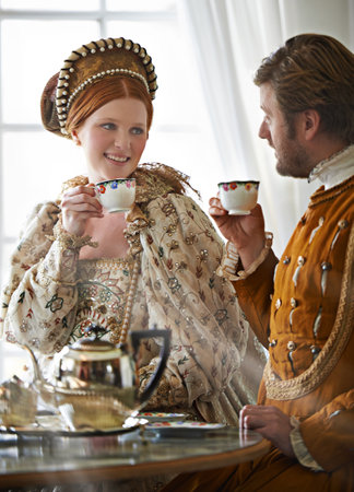 Tea with the Countess. A king and queen taking tea together at home.