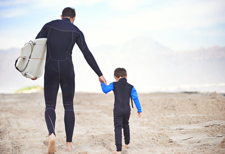 Lets head out to the ocean. Shjot of a father and son enjoying a day outdoors.の写真素材