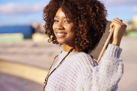 Born to skate. a young woman with her skateboard in a skatepark.