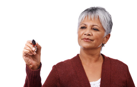 Mature lifestyle. Studio shot of a mature woman holding a marker isolated on white.の写真素材