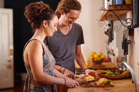 Its always about health. a Rastafarian couple cutting up fruit.の写真素材