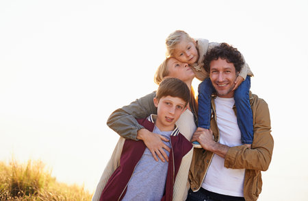 Spending time outdoors as a family. Cropped portrait of a loving family standing together in the...