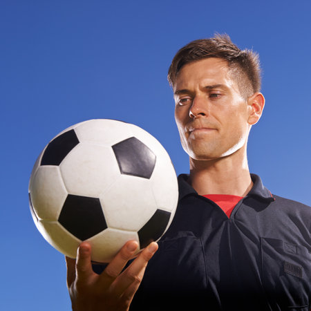 The match ball. a young footballer holding a ball in his hand.