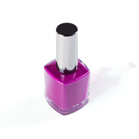 Add some purple into your beauty. Studio shot of a colorful nail varnish bottle.の写真素材