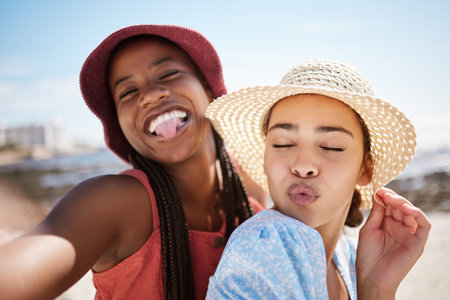 Happy, beach and friends with women and selfie for social media, summer and holiday. Travel, vacation and smile with woman and photography by the sea on phone camera for lifestyle, happiness and sunの写真素材
