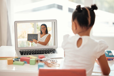 Girl, laptop and education with girl and teacher on video call, distance learning and homeschool online lesson. Learning, class and child enjoy math activity with friendly tutor at table in her homeの写真素材