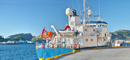 Explore the coastline of Bodo. A ship in the harbour in Bodo, Norway.
