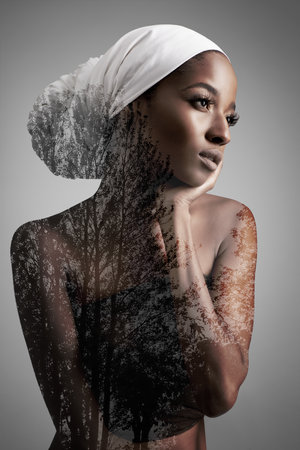 Beauty as natural as nature. Composite image of nature superimposed on a young woman.の写真素材