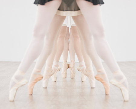 Ballet training, group dance and pointe feet, strong legs and dancing skill in performance class studio. Ballerina dancers, balance and practice line learning, creative theatre and concert productionの写真素材