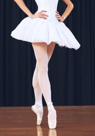 Ballet woman dancer on theatre stage for a dance performance or training for a professional art...
