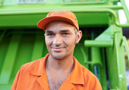 Hes keeping our streets clean. a male worker on garbage day.