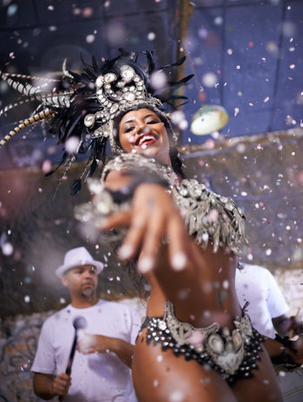 Performing a live show. Portrait of a woman performing with her band.