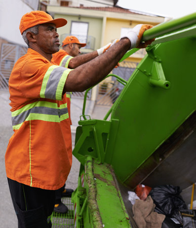 Keeping the city clean. a team of garbage collectors.