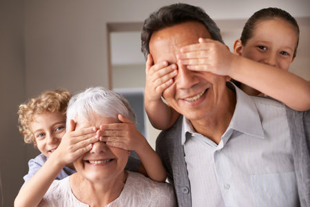 Grandparents are the best. a brother and sister having fun while visiting their grandparents.の写真素材