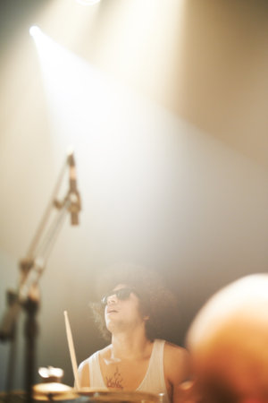 a band playing at a music festival-This concert was created for the sole purpose of this photo shoot, featuring 300 models and 3 live bands. All people in this shoot are model releasedの写真素材