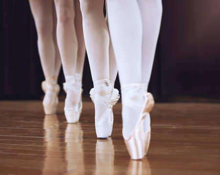 Ballet, fitness dancer and woman on theatre stage for dance workout, exercise and training creative art. Partnership, teamwork and zoom sport girl legs or ballerina women working together on concert.の写真素材