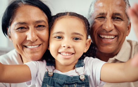 Selfie, face and girl bonding with grandparents, happy and smiling while relaxing at home together....