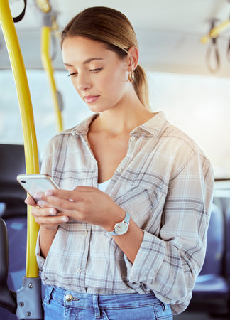 Travel, smartphone and woman on a bus or public transportation reading social media, online news or...