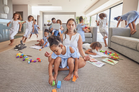 Meditation, calm and excited family children with high energy, have fun and running in living room. Multitasking relax dad, crazy kids playing and yoga mom meditate for peace, zen or mindset wellnessの写真素材