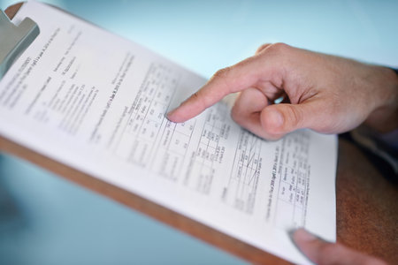 Reviewing the companys income. Cropped image of a businessman pointing at a financial document on a...