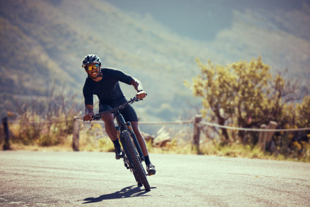 Mountain bike street, cycling exercise and man training for professional competition, happy with...