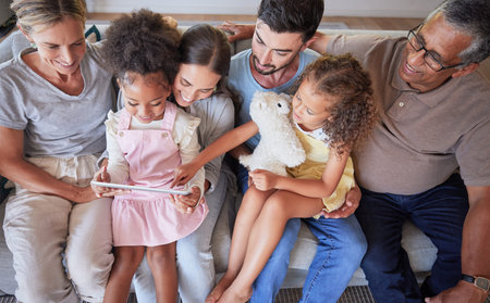 Elearning, children and family support on sofa with a tablet for online education, digital teaching...