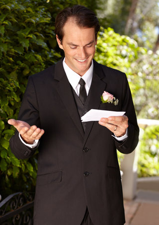 Preparing for his wedding vows. Handsome groom practicing his vows.の写真素材