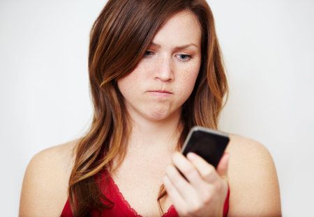 Are you kidding me. An angry young woman looking at her cellphone.