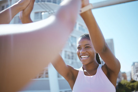 Black woman, fitness sports and high five in urban city for running success, athlete team support or...