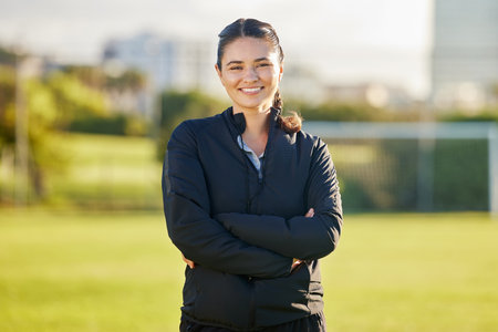 Soccer woman and coach portrait on field for match game in Mexico with optimistic and joyful smile. Proud, happy and excited Mexican football teacher smiling at professional sports tournament.の写真素材