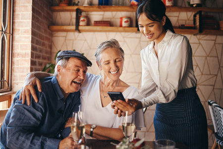 Couple, restaurant and date with a senior man and woman paying their bill with a waitress on her...