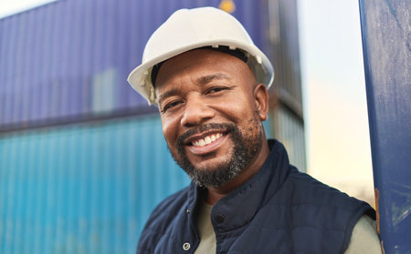 Logistics, supply chain and shipping with a black man delivery worker standing outdoor on a...