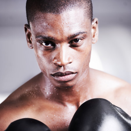Nothing but success will do. An african american boxer with a look of determination in his eyes.の写真素材