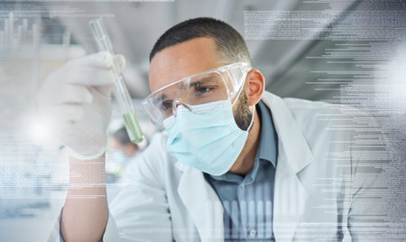 Covid, science and research with a man engineer holding a vial while working on innovation and development in a lab with overlay. Analytics, data and sample with a scientist at work in a laboratoryの写真素材