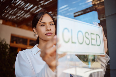 Restaurant small business, closed sign and waiter woman at local coffee shop startup finish service. Hospitality Mexico girl waitress manager, glass door and cafe store entrance notice announcementの写真素材