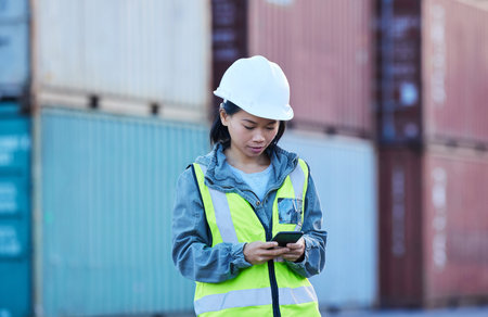 Warehouse, shipping and manager on a phone at factory plant, text and check delivery checklist and...