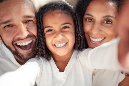 Selfie, happy family and portrait of girl bonding with mother and father, smile, relax and posing for picture. Love, cheerful and content child enjoying free time with her parents and taking photoの写真素材