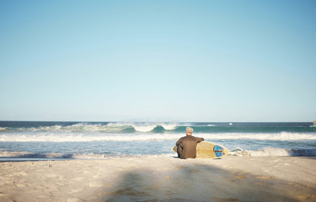 Surf, sea and sports with a man on the beach for surfing, fitness or training with a horizon view...