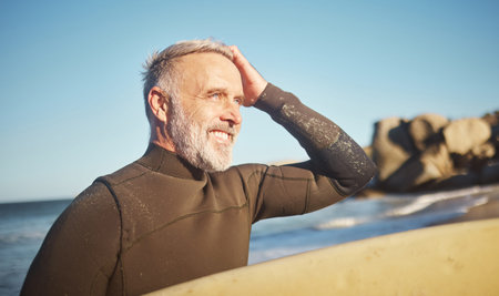 Elderly, man and beach to surf in summer for wellness, fitness and health on adventure. Senior,...