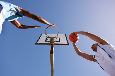 Equal opponents. Two basketball players playing a friendly game.