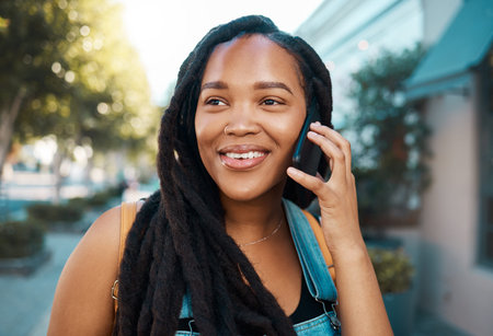 Happy black woman on the street, phone call on smartphone and talking on the pavement outside in the...