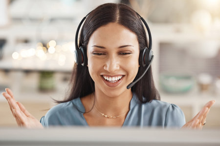 Call center, telemarketing or customer support agent consulting clients with headset in office....