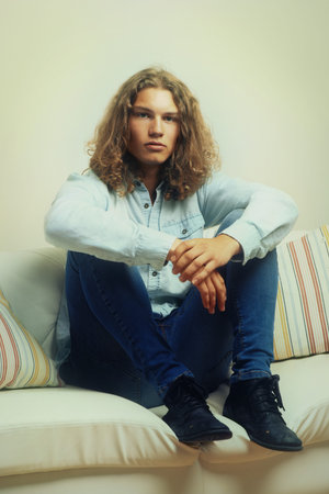 Taking it easy. Portrait of a handsome young man relaxing on a sofa.