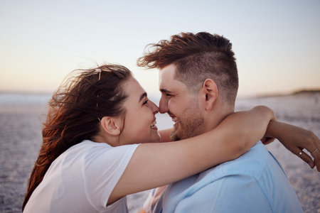 Couple with love, happy and together on a beach during vacation in hawaii. Man and woman hug...