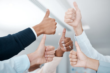 Hands, thumbs up and business people hand agreement closeup in support of trust, thank you and a job well done. Success, teamwork and trust with corporate team of colleagues showing yes in officeの写真素材