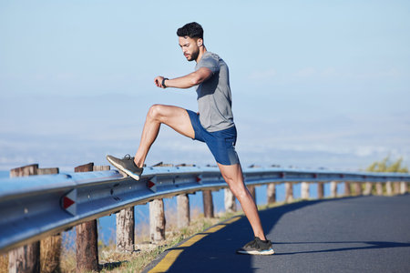 Runner, road and man on time by smartwatch to start running, exercise and cardio workout to burn fat...