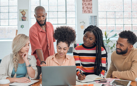 Group of happy diverse businesspeople having a meeting in a modern office at work. Young mixed race...