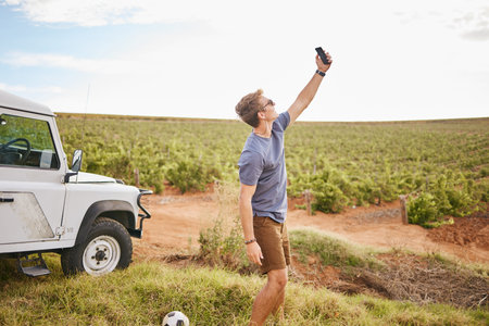 Phone selfie, travel and car road trip nature of a man using a mobile outdoor on a drive break....
