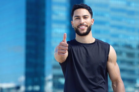 Man, thumbs up or fitness success in city workout, training or exercise for health, wellness and cardio. Portrait, smile and happy personal trainer or runner with thank you or motivation support handの写真素材