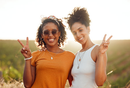 Women, friends and happy with hands show peace on road trip, travel or vacation together. Black woman, smile and sign language showing harmony outdoor in happiness, solidarity and relax in summerの写真素材